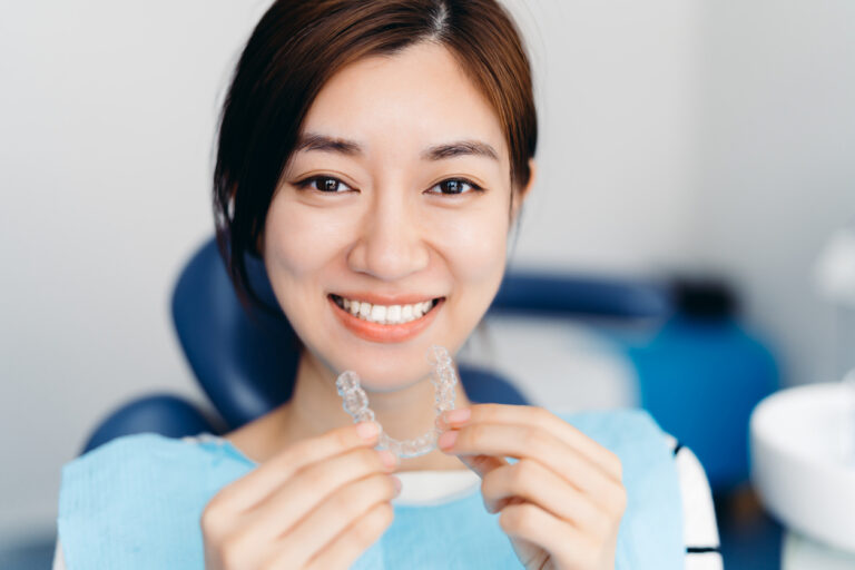 Patient with Invisalign aligner at Dental Office